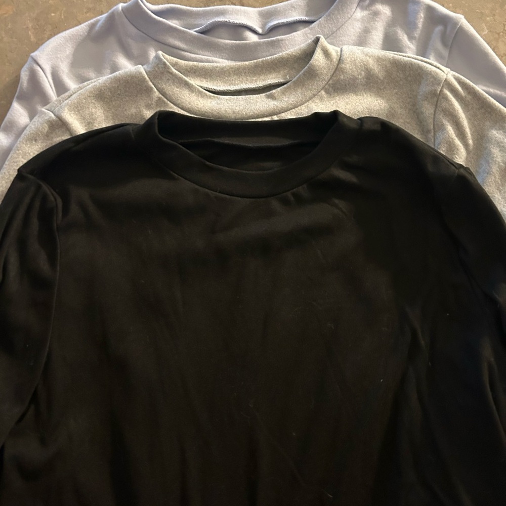 Black, Gray, and Light Blue Crewneck Shirts